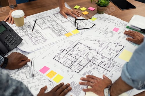Preview: Architects working on blueprints