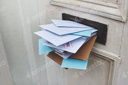 Preview: Addressed to you. Cropped shot of letters in a letter box.