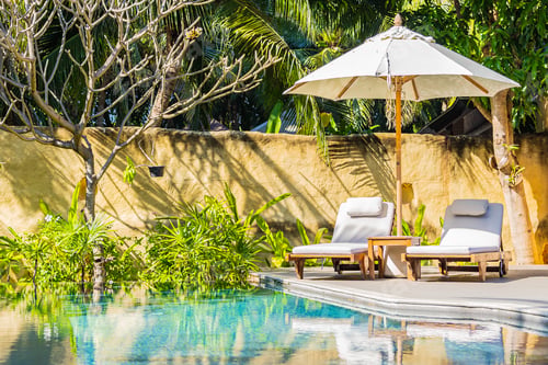 Preview: Umbrella and chair around outdoor swimming pool