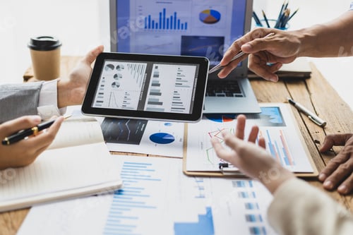 Preview: Business people discuss marketing growth chart and make business plan.