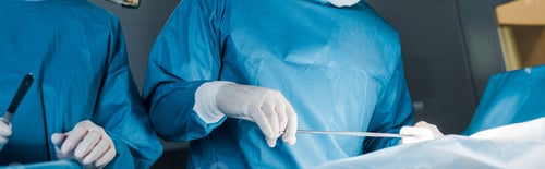 Preview: panoramic shot of nurse and surgeon in uniforms doing operation