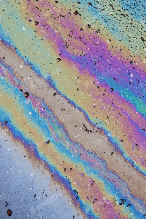 Preview: Color Gasoline fuel spots on Asphalt Road as Texture or Background. Iridescent stains of gasoline.