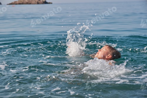 Preview: The child is drowning in the sea, screaming and waving his arms.