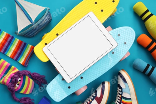 Preview: Flat lay composition with modern tablet on light blue background. Space for text