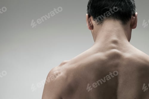 Preview: Man from behind showcasing strong back muscles
