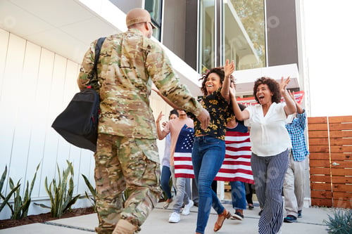 Preview: Family welcoming back millennial black soldier returning home,low angle view