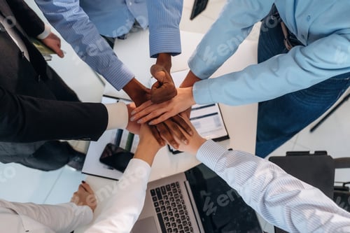 Preview: Top view of hands of business people that are celebrating success