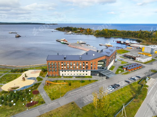 Preview: Lakeside hotel, marina, and leisure area aerial view