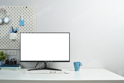 Preview: Blank computer monitor, coffee cup, houseplant, stationery and peg board on wall