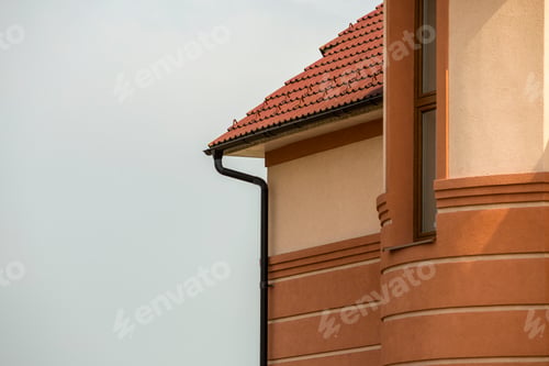 Preview: Close-up detail side stucco wall of big modern expensive residential family cottage