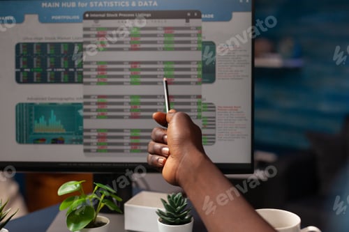 Preview: Closeup of young freelancer hand pointing at crypto currency investment value