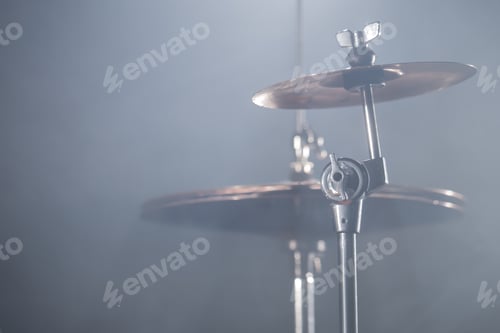 Preview: Close-up Drum set in a dark room against the backdrop of the spotlight.