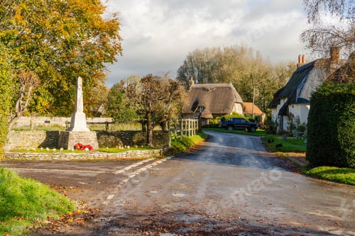 Preview: The centre of the village of Tarrant Monkton in Dorset, England UK, showing the war memorial .