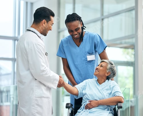 Preview: Handshake, hospital and surgery doctor with patient or wheelchair user for thank you, medical or co