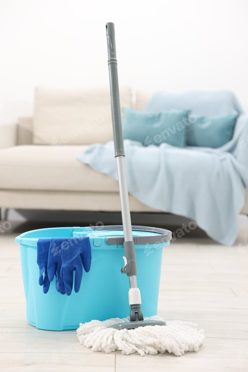 Preview: String mop, bucket and gloves on floor indoors