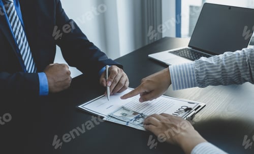 Preview: Business Deal Signed on Desk with Cash Money