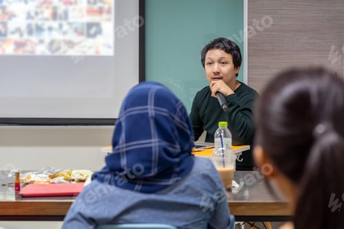 Preview: Asian Speaker or lecture with casual suit giving speech in front of the room presenting
