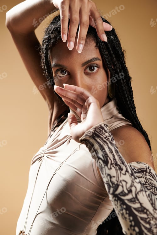 Preview: A stylish young woman showcasing elegance and grace with a unique pose in a captivating setting