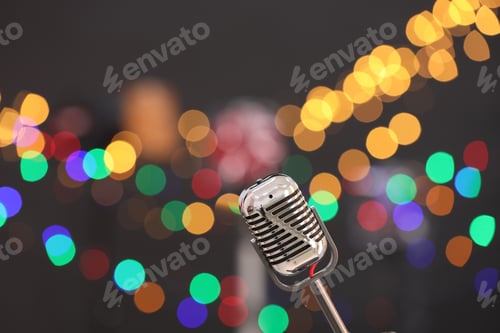 Preview: Vintage microphone on dark background with blurred lights, space for text. Musical equipment