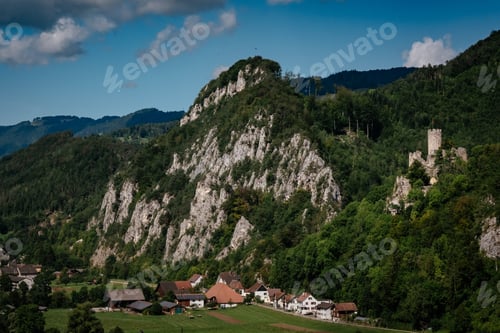 Preview: romantic castle on top of a hill in a mountainous valley