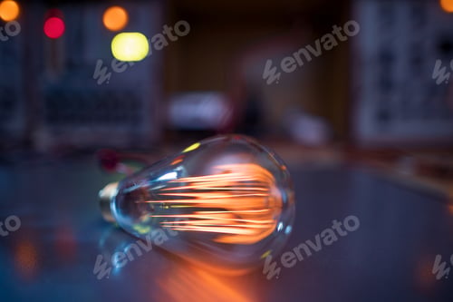 Preview: An incandescent lamp illuminates a dark room with orange light