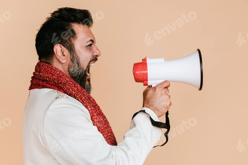 Preview: Indian man screaming into a megaphone