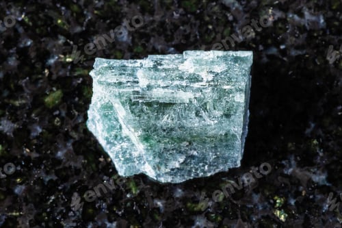 Preview: sample of rough indigolite mineral on black