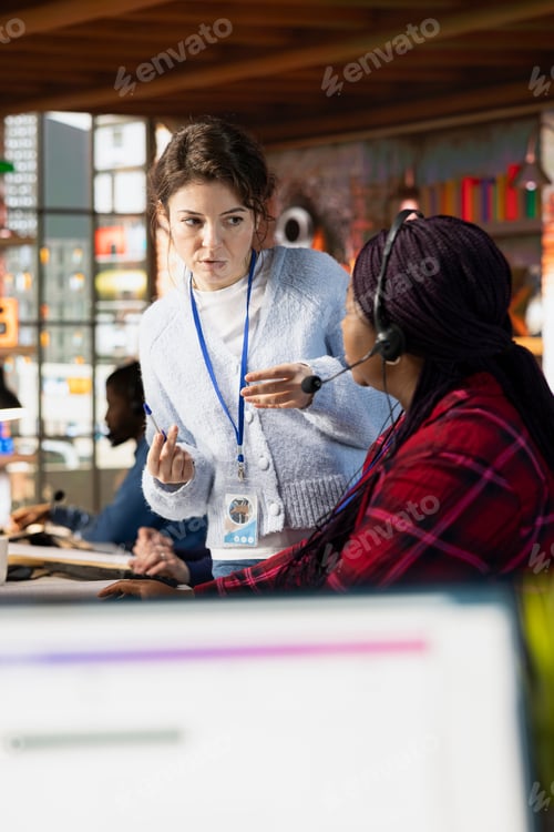 Preview: Call center onboarding specialist providing training to new agent recruit