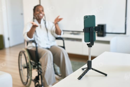 Preview: Smiling Woman Using Smartphone on Tripod in Living Room