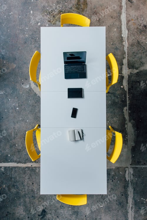 Preview: Conference table seen from above, tablet, smartphone, laptop and notebook