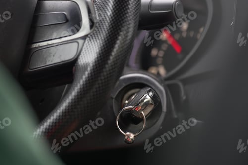 Preview: Close-up of car ignition and steering wheel at a roadside stop