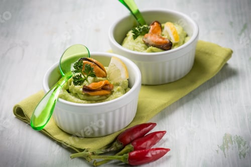 Preview: avocado cream with mussel appetizer, selective focus