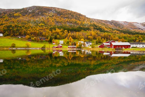 Preview: autumn rural landscape with houses near river, Norway