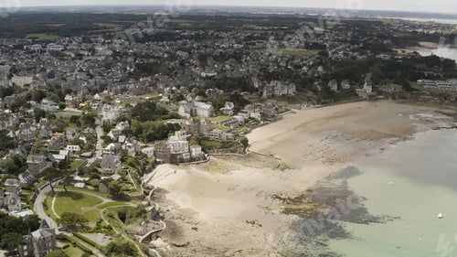 Preview: Aerial wonderful view of a city with many greenery and beautiful architecture located near the sea