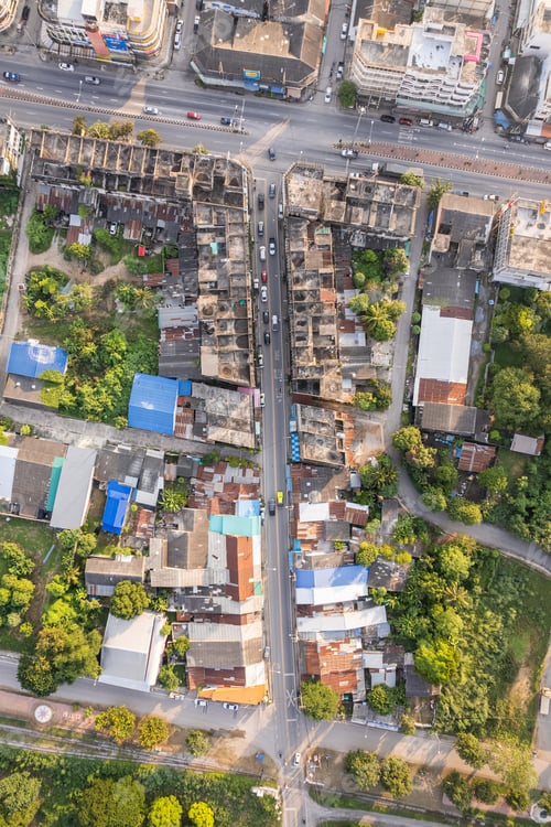 Preview: Top view of commercial building and crowded village and car on the alley in suburban