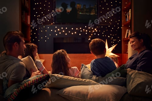 Preview: Family Enjoying Movie Night At Home Together