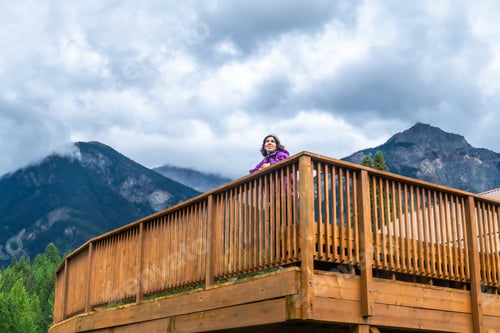 Preview: Tourist enjoying breathtaking view of mount robson in the canadian rockies