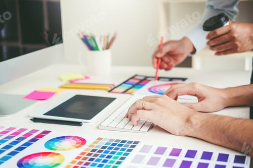 Preview: Graphic designer drawing on graphics tablet at workplace