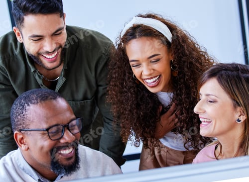 Preview: Shot of a group of businesspeople working together on a computer in an office