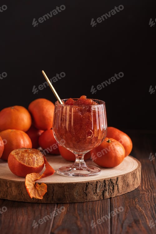 Preview: Fresh Tangerines with Jam Glass on dark wooden Background. Rustic Gourmet Composition
