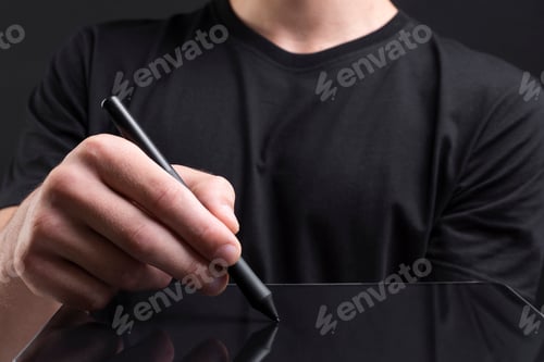 Preview: Businessman holding tablet and writing an invisible screen with stylus social media cover