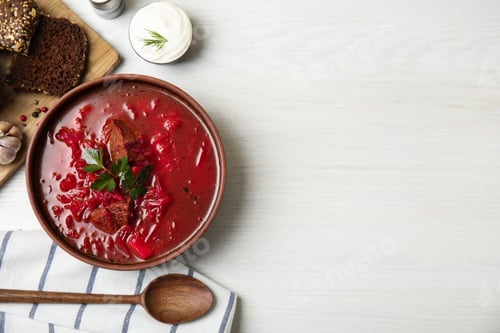 Preview: Stylish brown clay bowl with Ukrainian borsch served on white wooden table, flat lay. Space for text