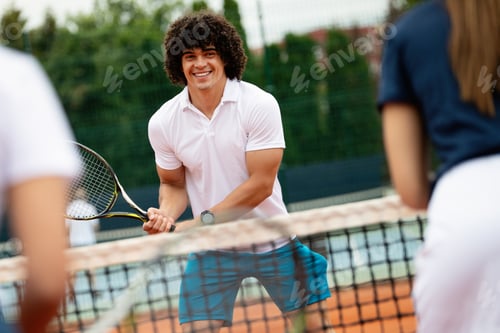 Preview: Fit happy poeple playing tennis together. Sport concept