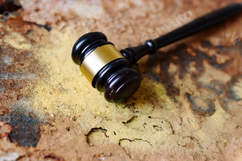 Preview: Judge gavel on rusty metal background showing outdated justice concept with copy space