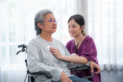 Preview: Senior Woman Getting Healthcare from Young Caretaker