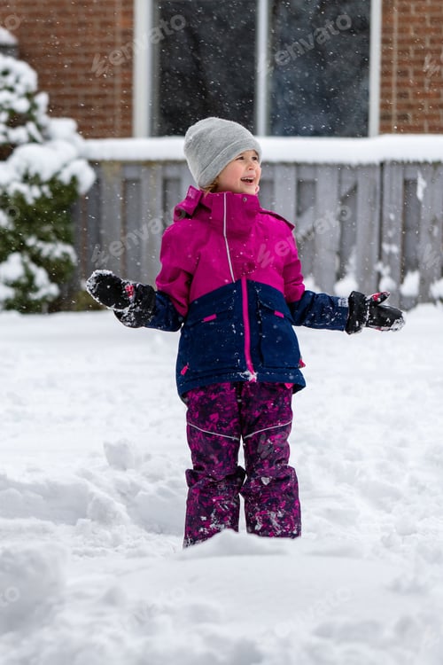 Preview: Girl Plays in the Snow on a Winter Day
