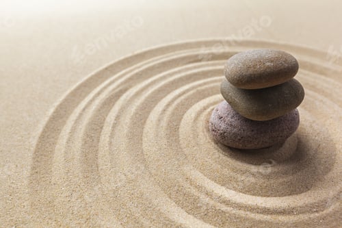 Preview: Stones placed in sand with lines around them showing calm arrangement and focus on balance
