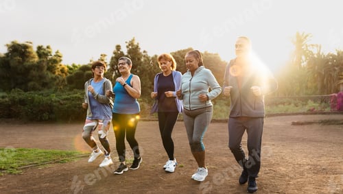 Preview: Group of diverse senior friends jogging together at park