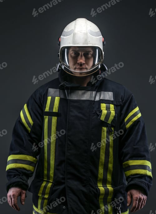 Preview: Firefighter in uniform on grey background