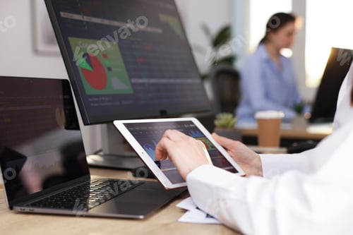Preview: Stock exchange. Woman working at desk in office, closeup